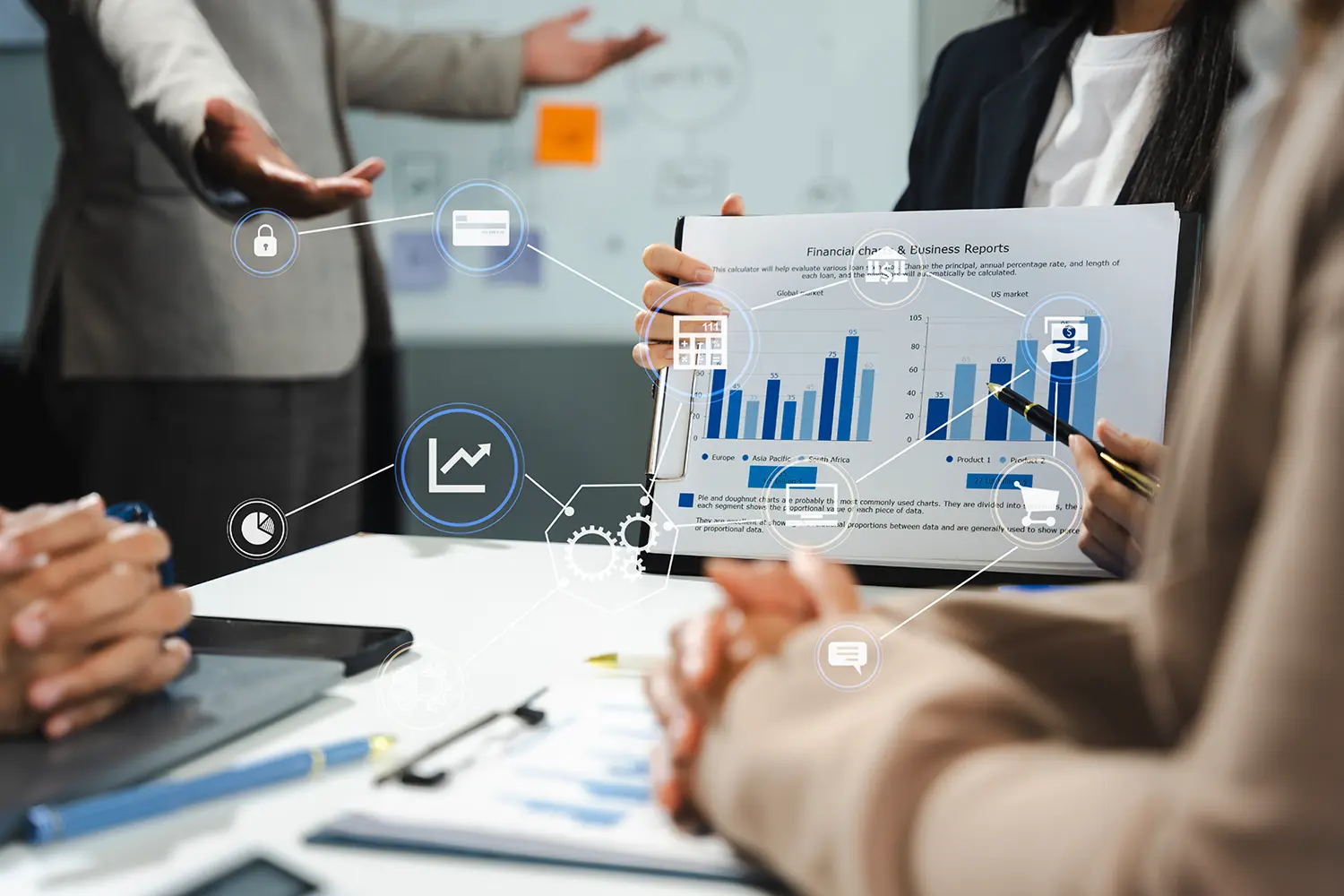 Four people are in a meeting. The close-up is supplemented by graphics. 